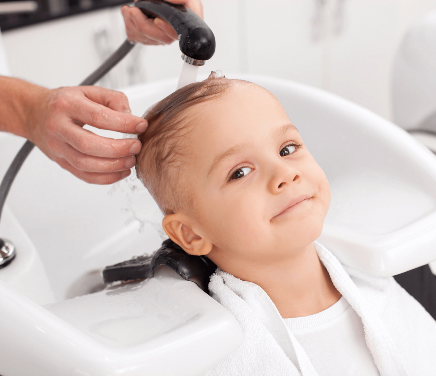 long hair kid getting her hair washed