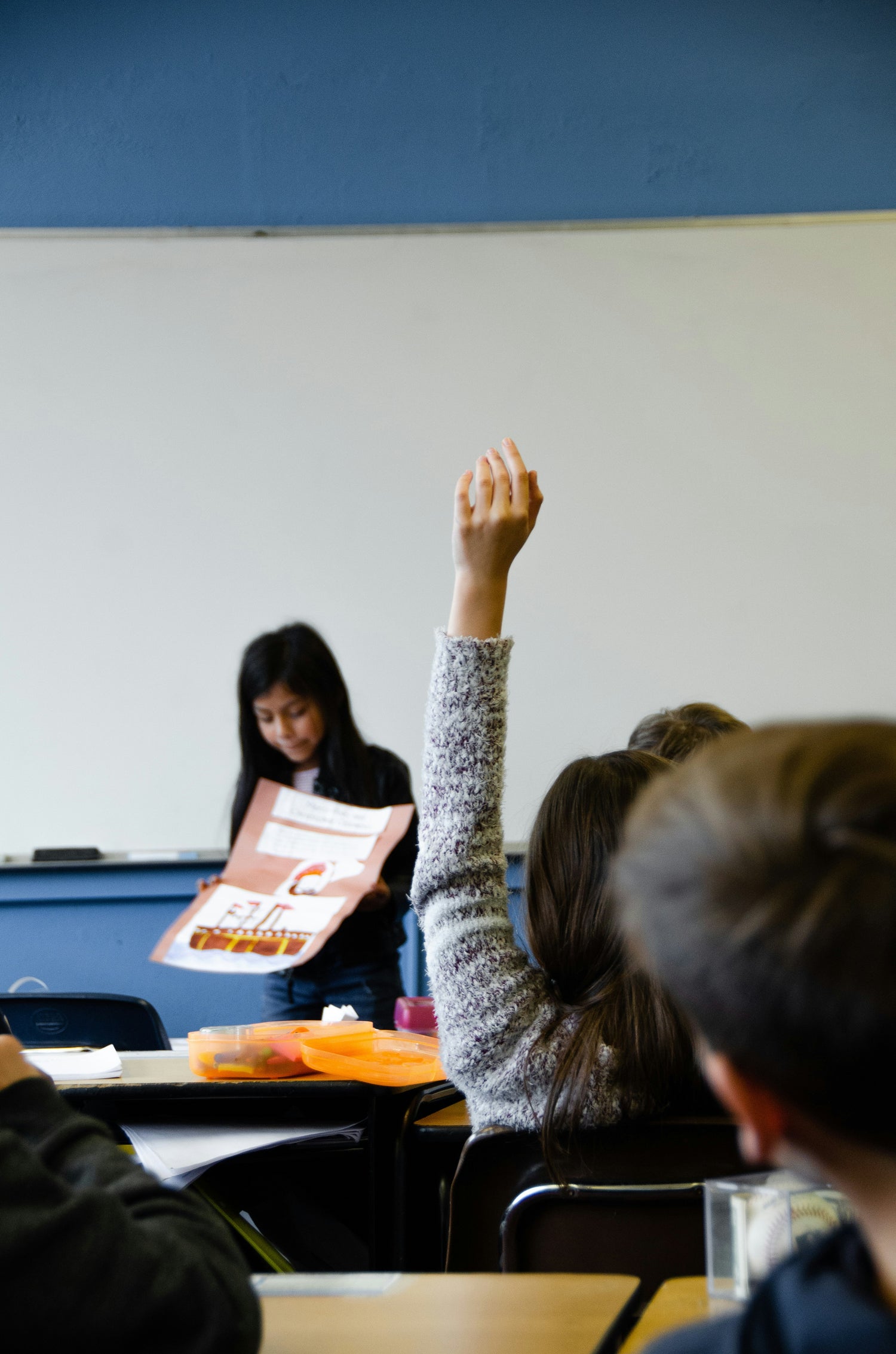 school kid hand raised